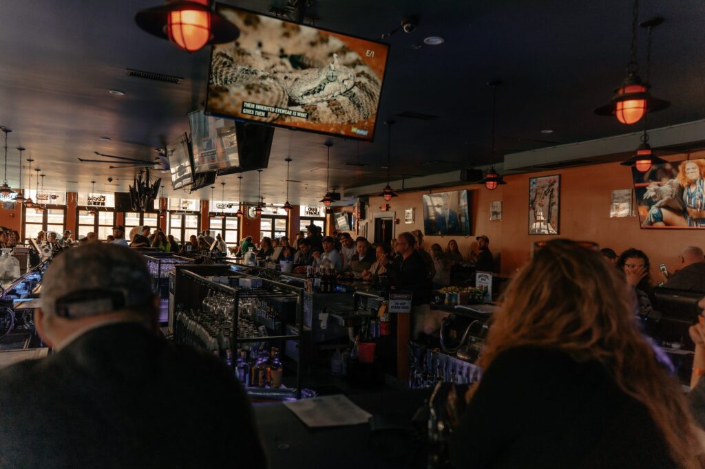 Crowd gathered around the bar during Rock the Green Beret