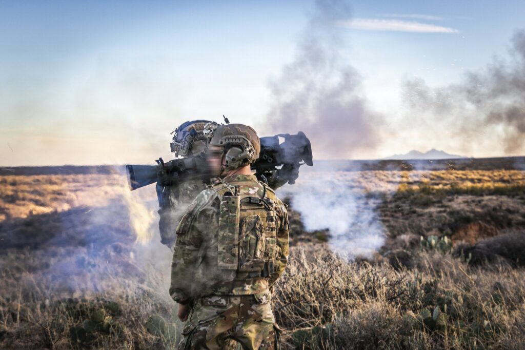 Green Berets fire a shoulder-launched recoilless rifle during live-fire training, a source of repeated blast exposure addressed by SOF brain health care